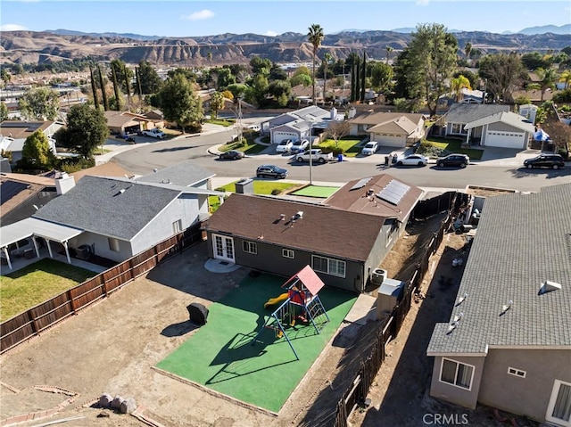 birds eye view of property with a mountain view