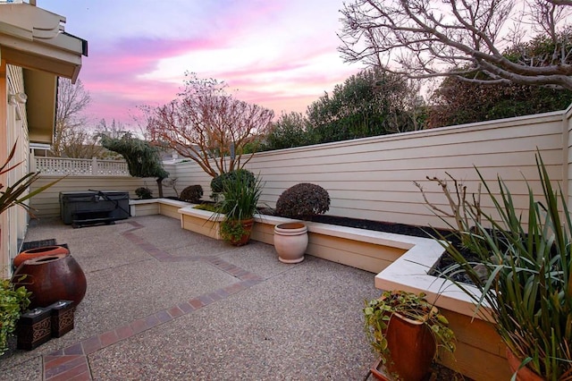 patio terrace at dusk with a grill