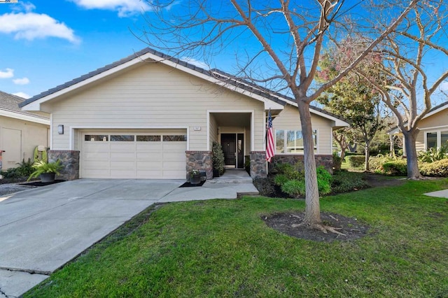 view of front of home featuring a garage and a front lawn