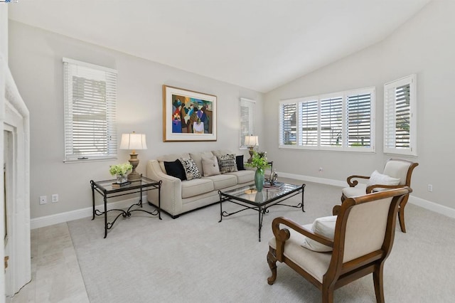 living room featuring lofted ceiling and light colored carpet