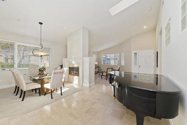 dining room featuring high vaulted ceiling