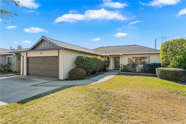 single story home featuring a garage and a front lawn