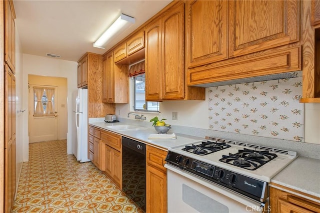 kitchen with sink and white appliances