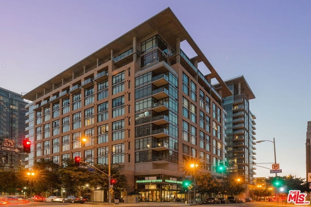 view of outdoor building at dusk