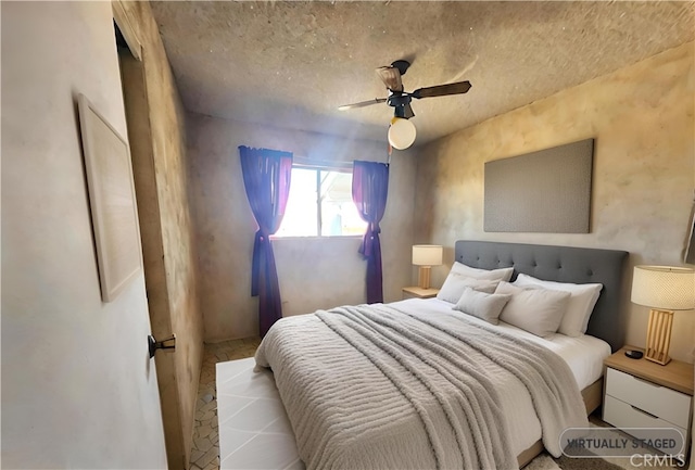 bedroom with ceiling fan and light hardwood / wood-style floors