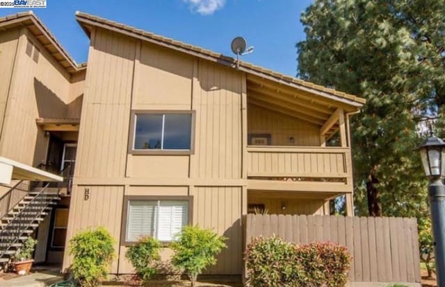 view of property exterior with a balcony