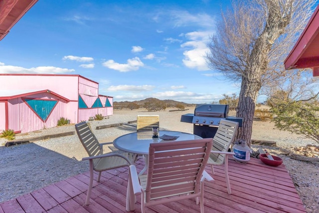 wooden deck with grilling area