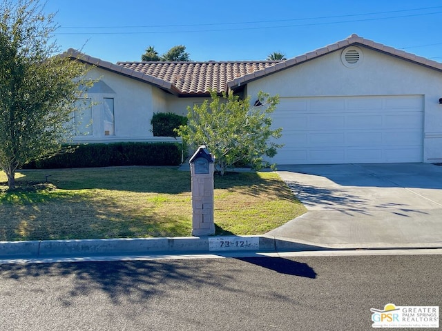 ranch-style home with a front lawn and a garage