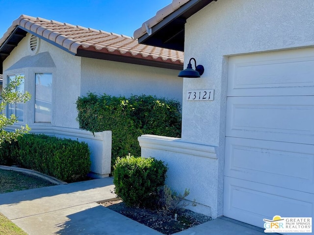 view of property exterior with a garage