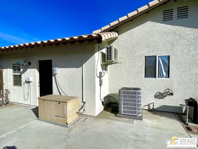 exterior space featuring central AC unit and a patio area