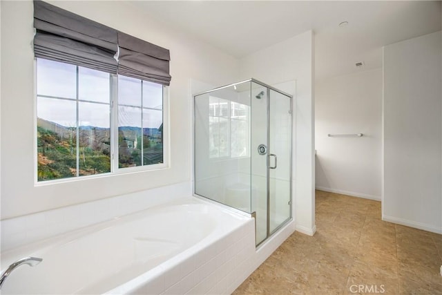 bathroom featuring a mountain view and separate shower and tub