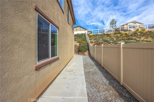 view of side of home with a patio