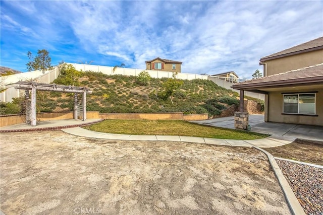 view of yard featuring a patio and a pergola