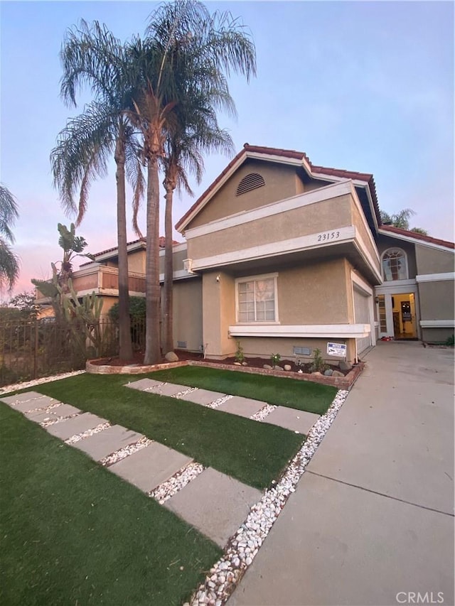 view of front of home with a lawn