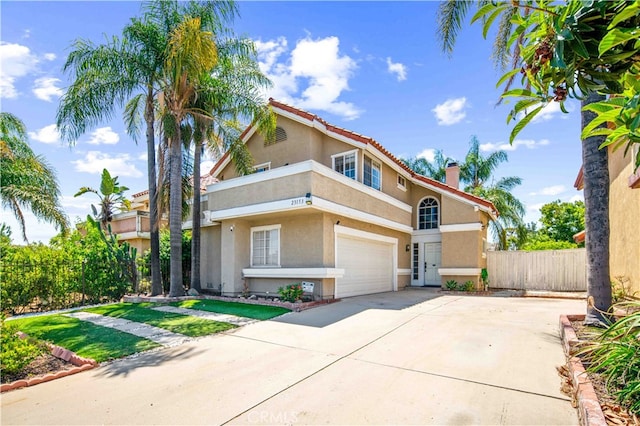 mediterranean / spanish home featuring a garage