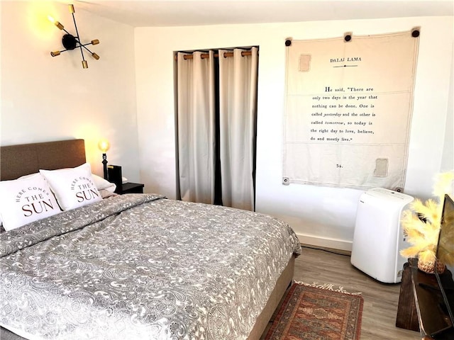 bedroom featuring wood-type flooring