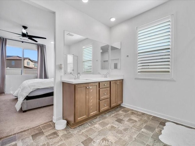 bathroom featuring ceiling fan and vanity