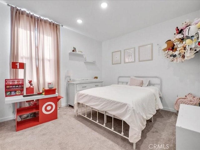 bedroom featuring light carpet