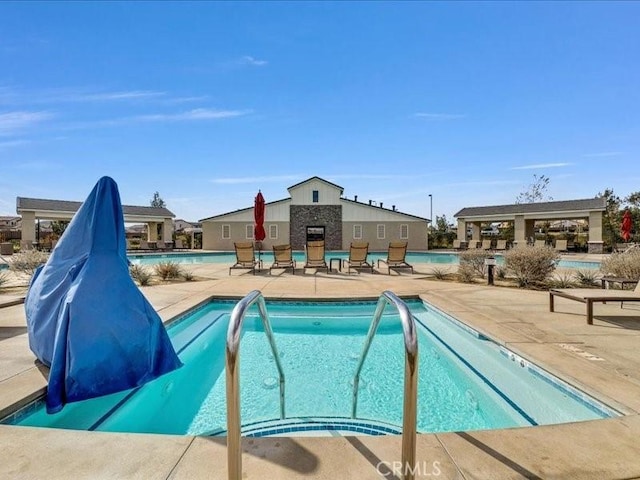 view of pool featuring a patio area