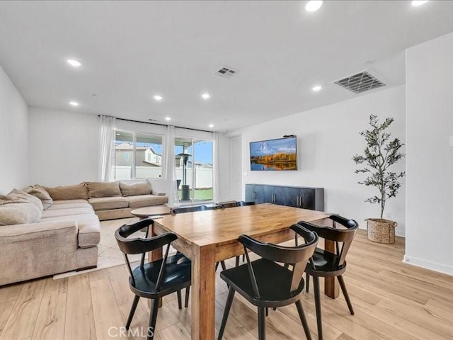 dining space featuring light hardwood / wood-style floors