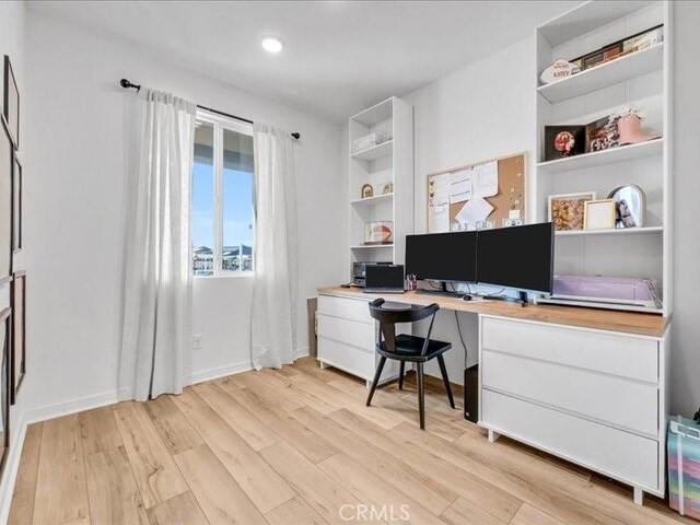 home office featuring light hardwood / wood-style floors