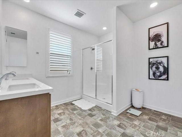 bathroom with vanity and an enclosed shower