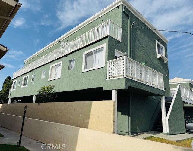 view of home's exterior with a balcony