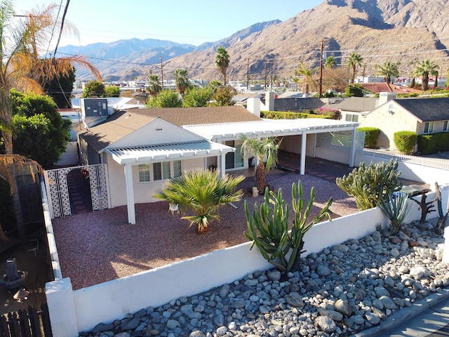 view of front of house featuring a pergola and a mountain view