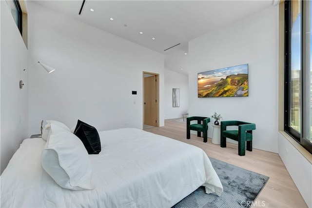 bedroom with light hardwood / wood-style floors