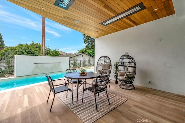 view of patio / terrace featuring a fenced in pool