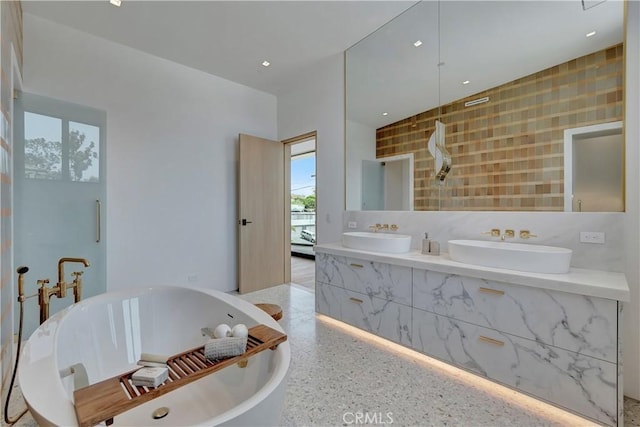 bathroom featuring a bath and vanity