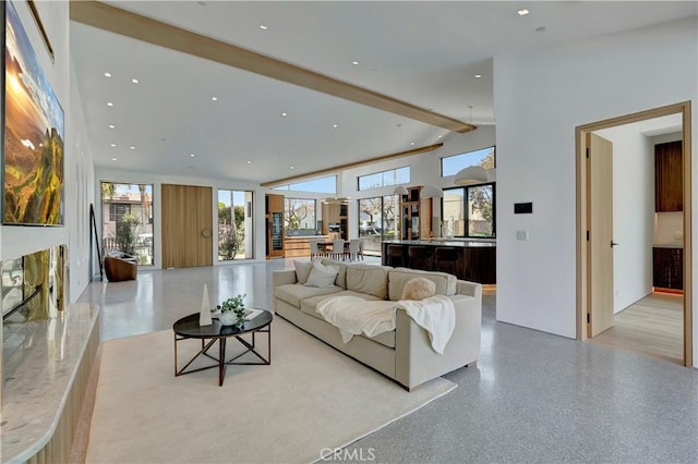 living room featuring beamed ceiling