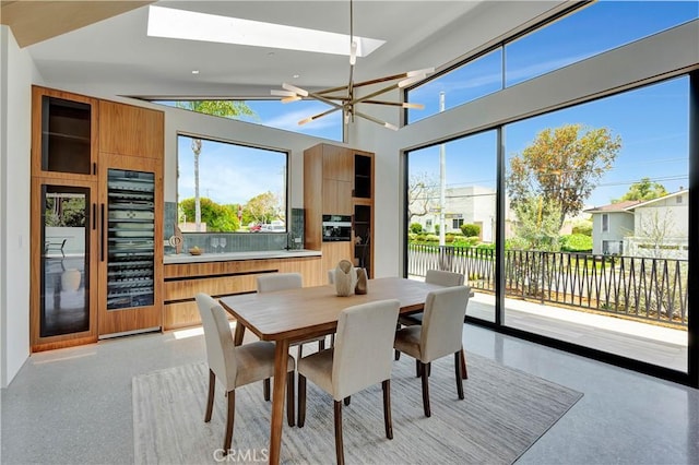 dining space featuring vaulted ceiling and a chandelier