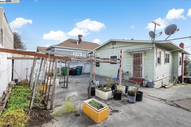 back of property with a patio area