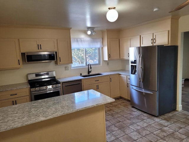 kitchen with light stone counters, sink, crown molding, and stainless steel appliances