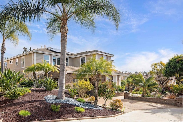 view of front of property with solar panels