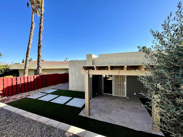 back of house featuring a patio area