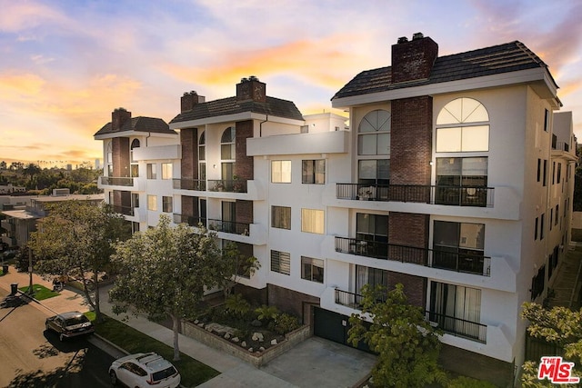 view of outdoor building at dusk