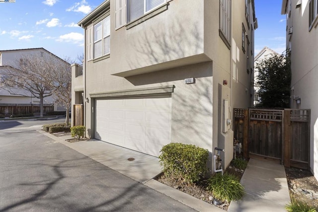 view of side of home featuring a garage