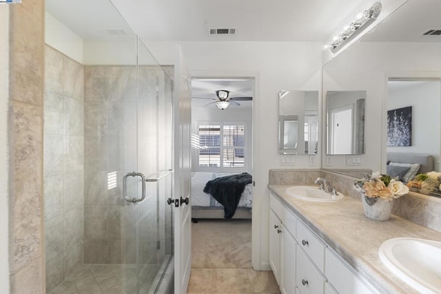 bathroom with vanity, tile patterned flooring, and walk in shower