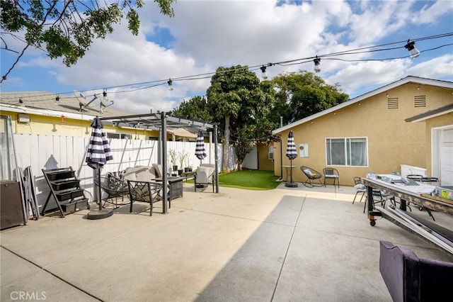 view of patio / terrace featuring fence and a pergola