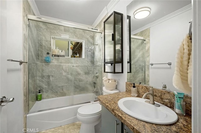 full bath with vanity, crown molding, toilet, and combined bath / shower with glass door