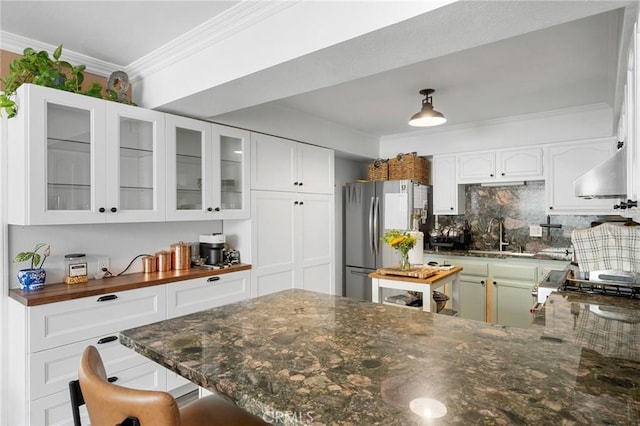 18509 Crenshaw Blvd, Torrance, CA 90504 - kitchen featuring freestanding refrigerator, a sink, ornamental molding, wall chimney range hood, and tasteful backsplash