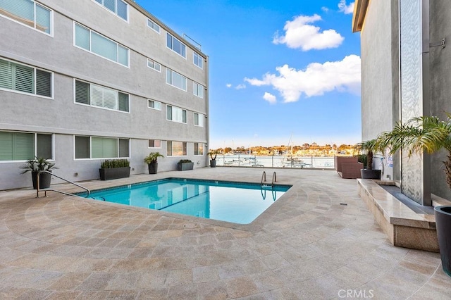 view of swimming pool featuring a patio