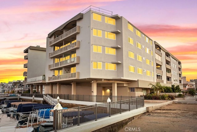 view of outdoor building at dusk