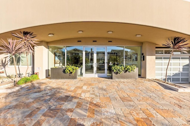 property entrance featuring a patio