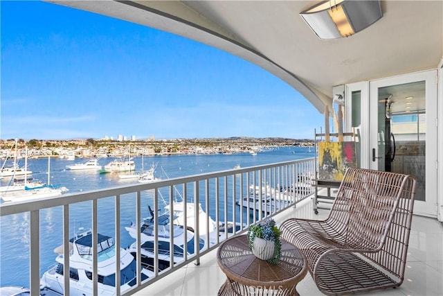 balcony featuring a water view