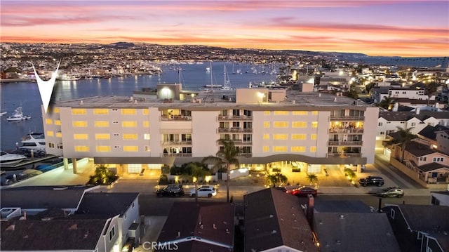 aerial view at dusk with a water view