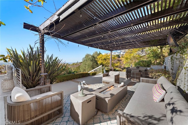 view of patio with a pergola and an outdoor living space with a fire pit