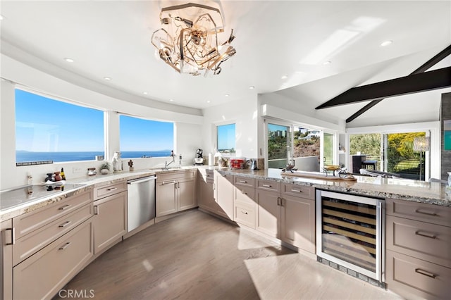 kitchen with wine cooler, dishwasher, vaulted ceiling, a water view, and light stone counters